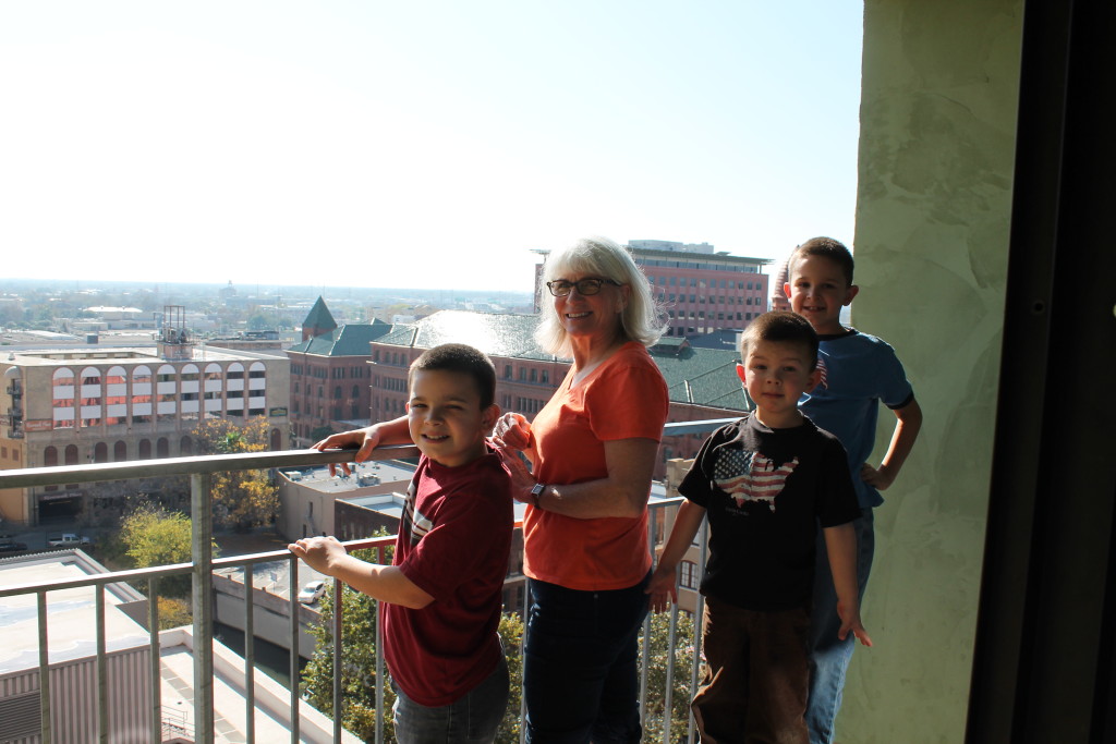 My mother, Delores Danzer, and the boys on the balcony of our room at the Drury Plaza Hotel River Walk