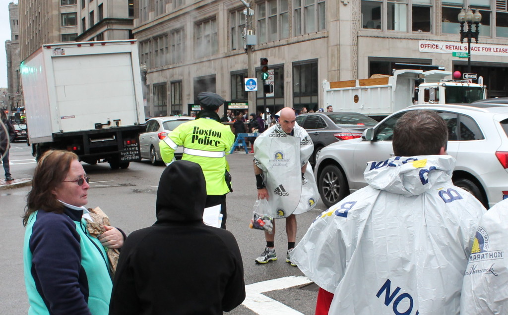 This man was having trouble crossing the street.  Boston's finest were there to assist.