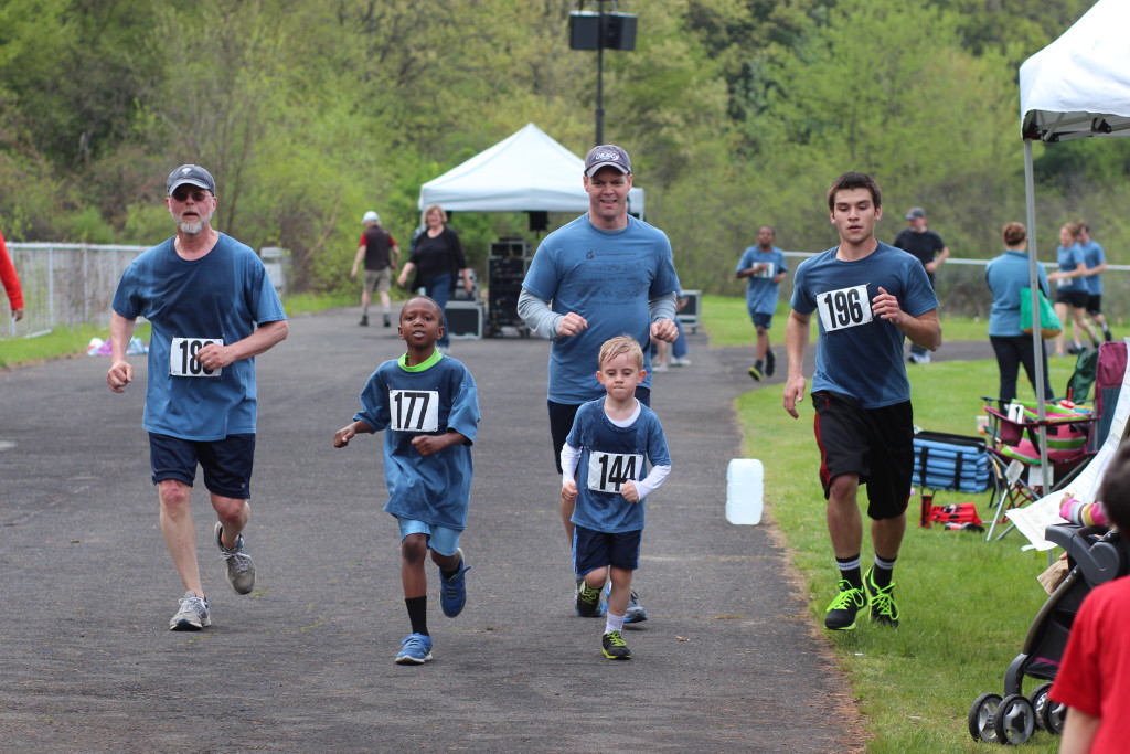 Dr. Jeffrey Brown (center) running with Grant in 2012.