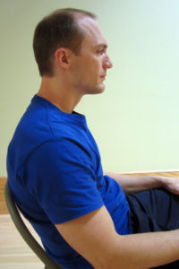 Dr. Ben demonstrates bad posture.