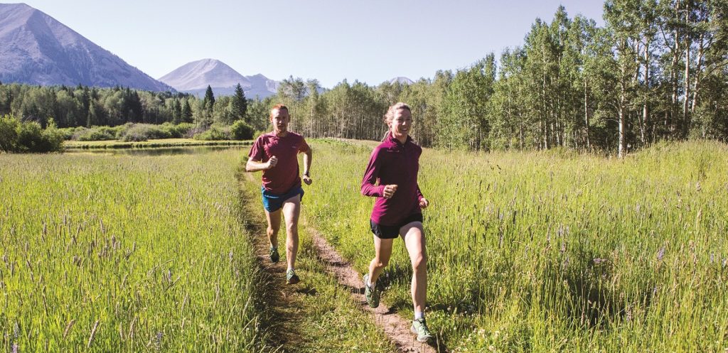 Bryon Powell and Meghan Hicks running a trail in Moab, Utah. Credit Kirsten Kortebein