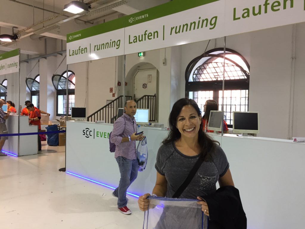Angie at bib pickup. MTA'er Marc Glorioso in the background.